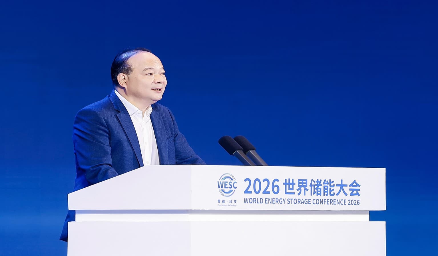 CATL Chairman Robin Zeng speaking at a podium at the World Energy Storage Conference
