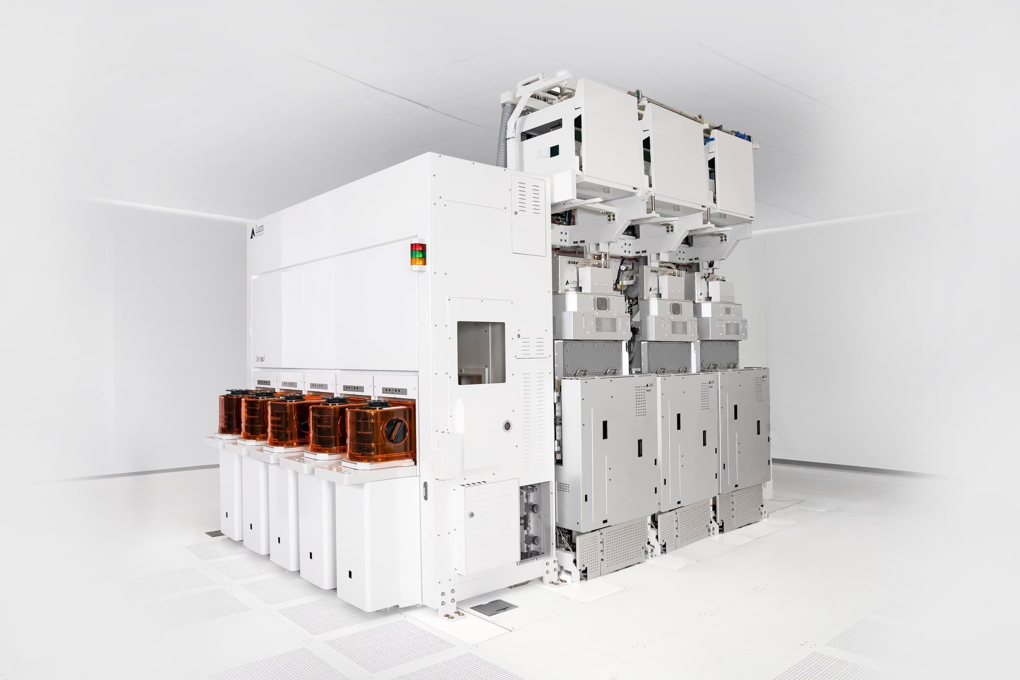 White Lam Research wafer fabrication tool with front-opening wafer carriers in a cleanroom, from the company's product gallery