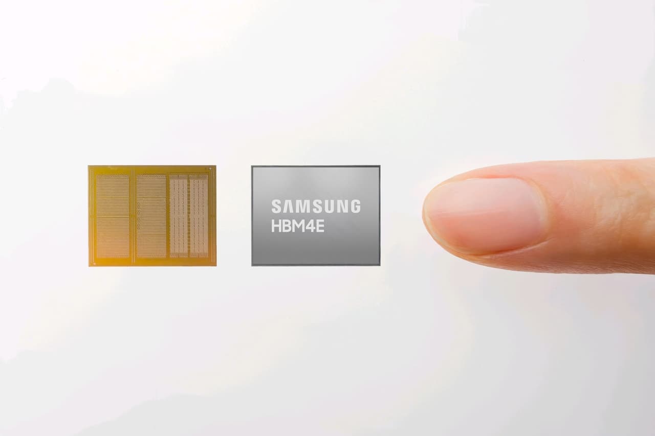 Samsung HBM4E memory chip beside an unpackaged package, with a fingertip for scale