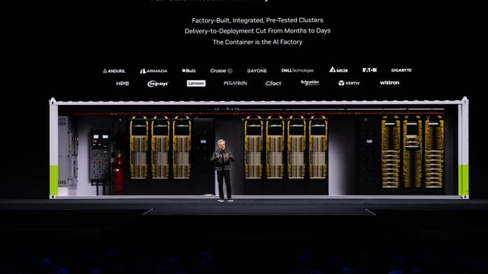 Jensen Huang on stage at NVIDIA GTC Berlin beside the DSX Pod, a container-sized mini data center