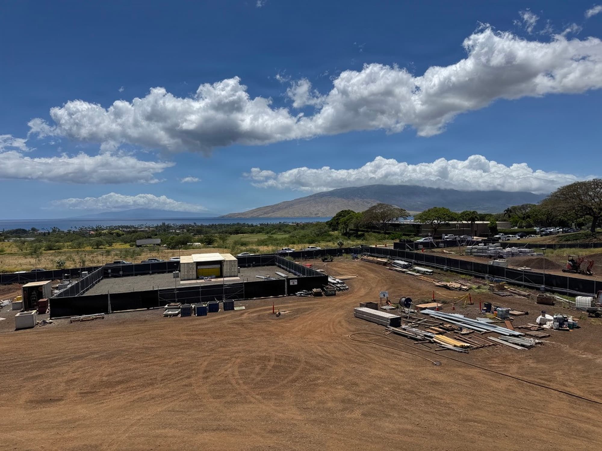 Construction site of the future 15th Space Surveillance Squadron facility in Kihei, Maui, with fenced pad and mountain behind