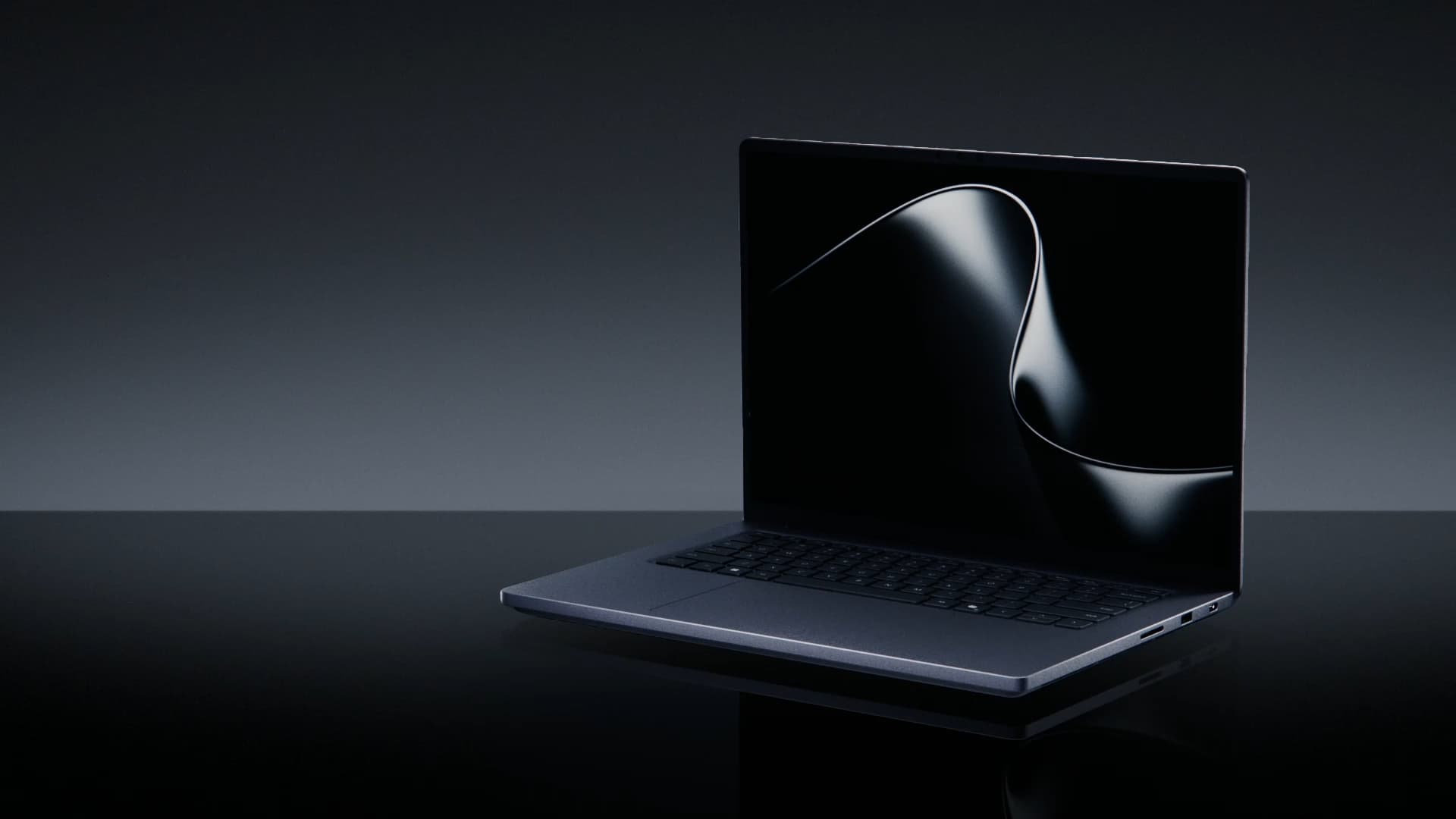 Microsoft Surface Laptop Ultra 15-inch laptop open on a dark reflective surface, from Microsoft's product page