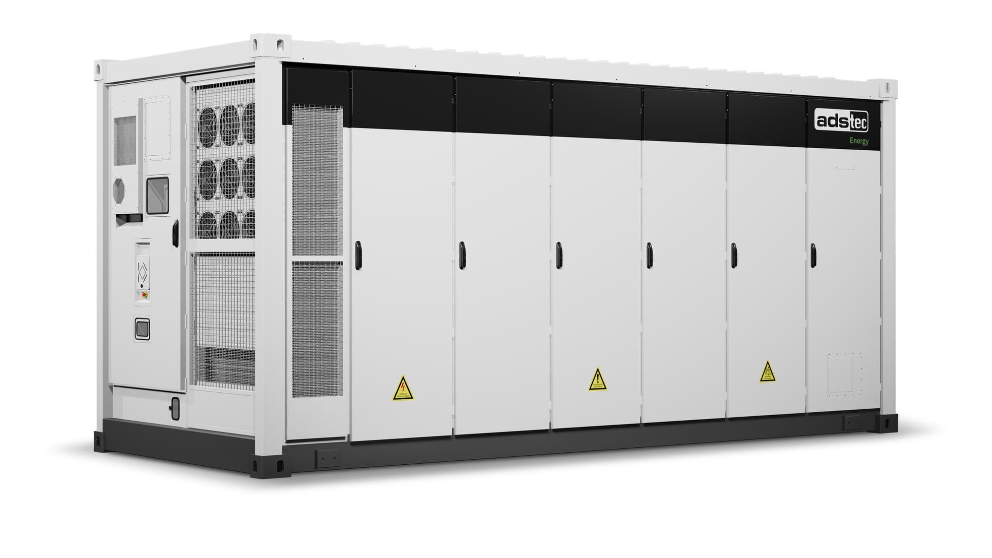 White ADS-TEC Energy containerized battery storage unit with six doors and cooling fans, shown from the side